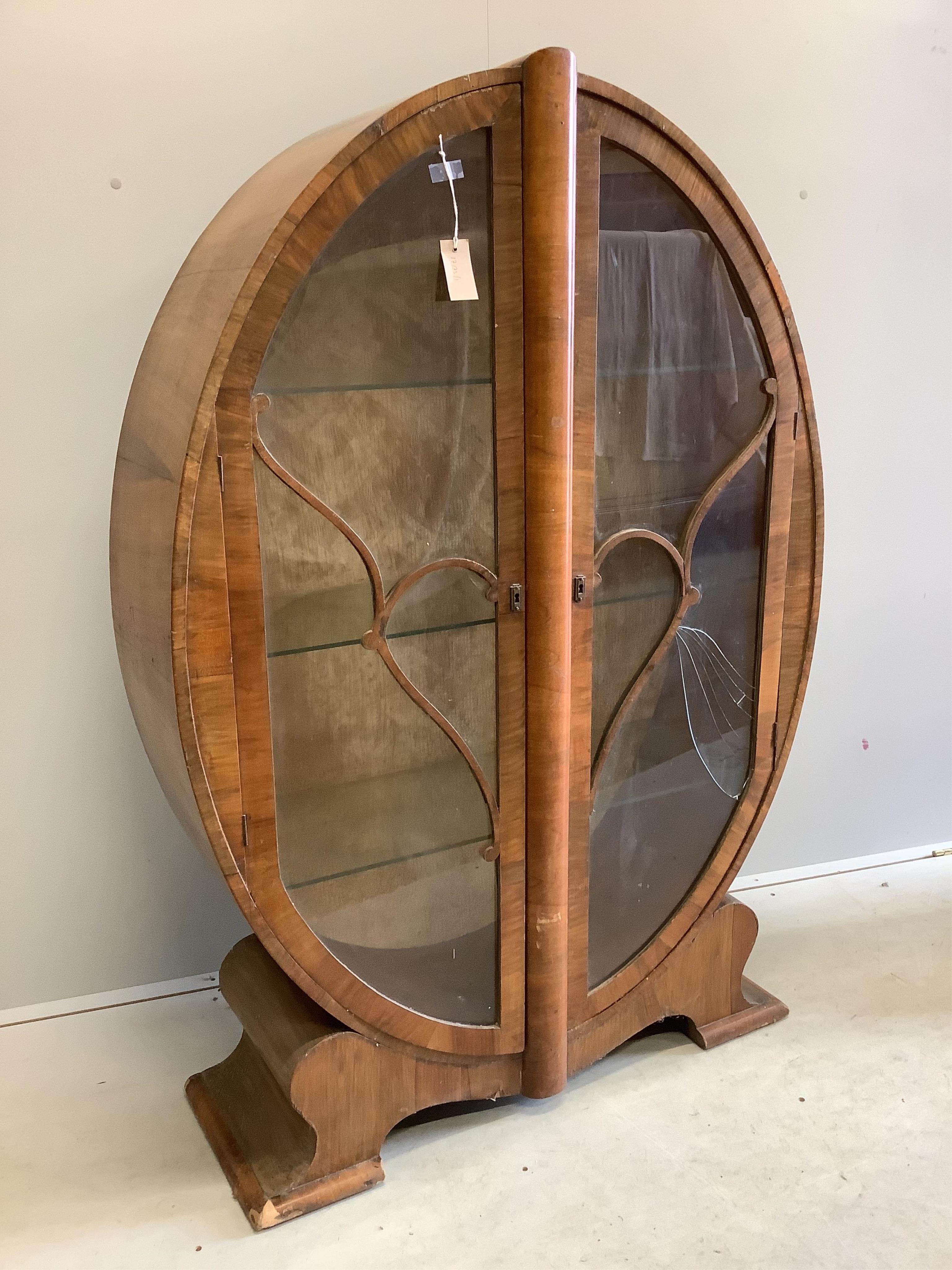 An Art Deco walnut display cabinet, width 98cm, depth 32cm, height 142cm. Condition - poor, one glass pane damaged